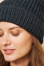 Close-up of the black ribbed self-heating knit beanie