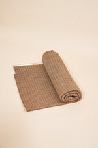 Toast FibreHeat self-heating knit throw blanket, rolled