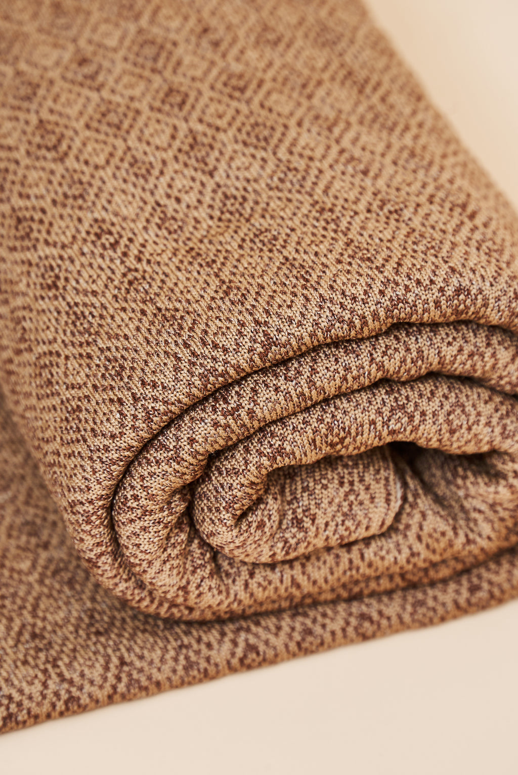 Close-up of the Toast throw blanket’s diamond knit texture