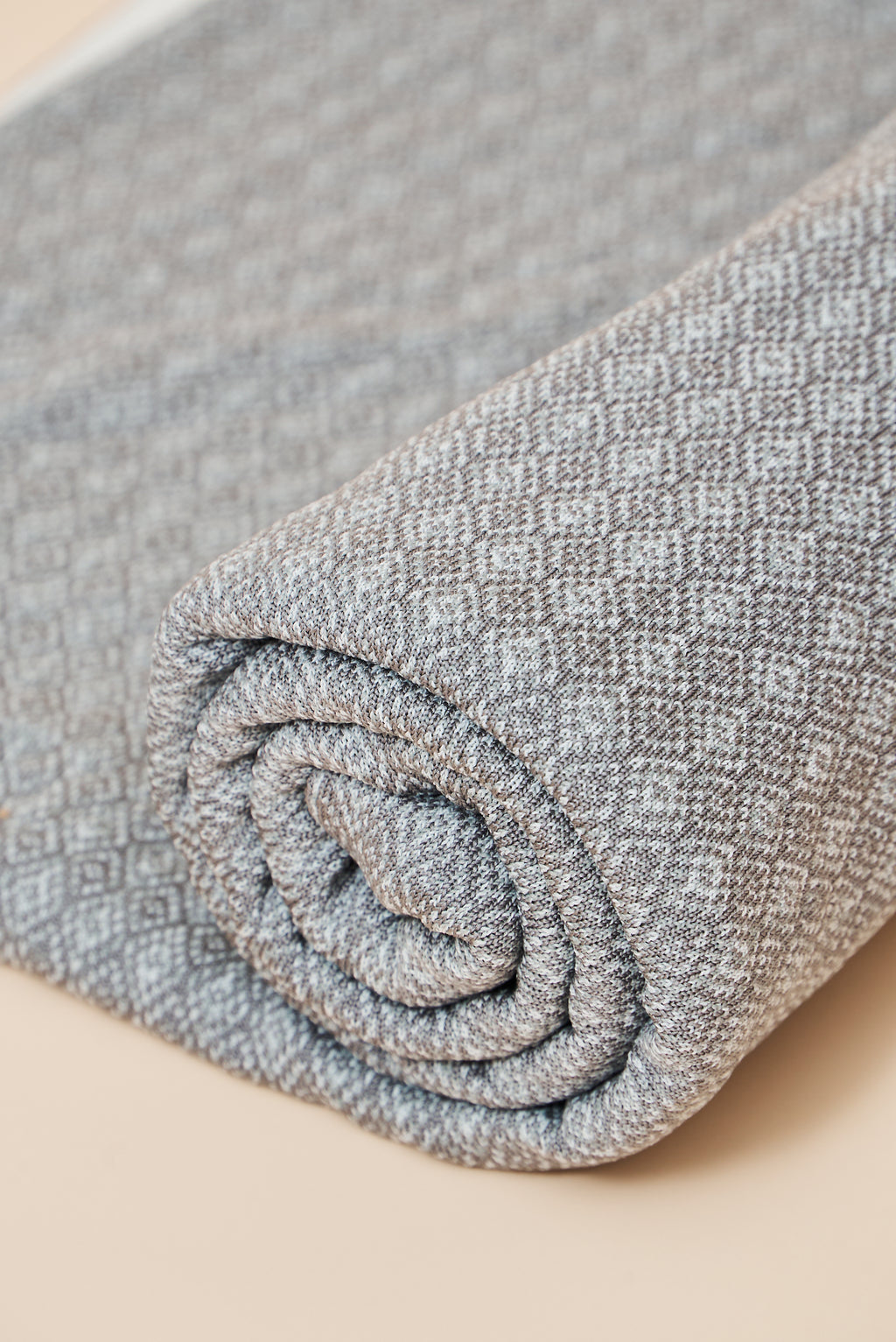 Close-up of the Slate throw blanket’s diamond knit texture