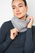 Woman wearing the medium grey and ecru two-tone ribbed wool neck warmer