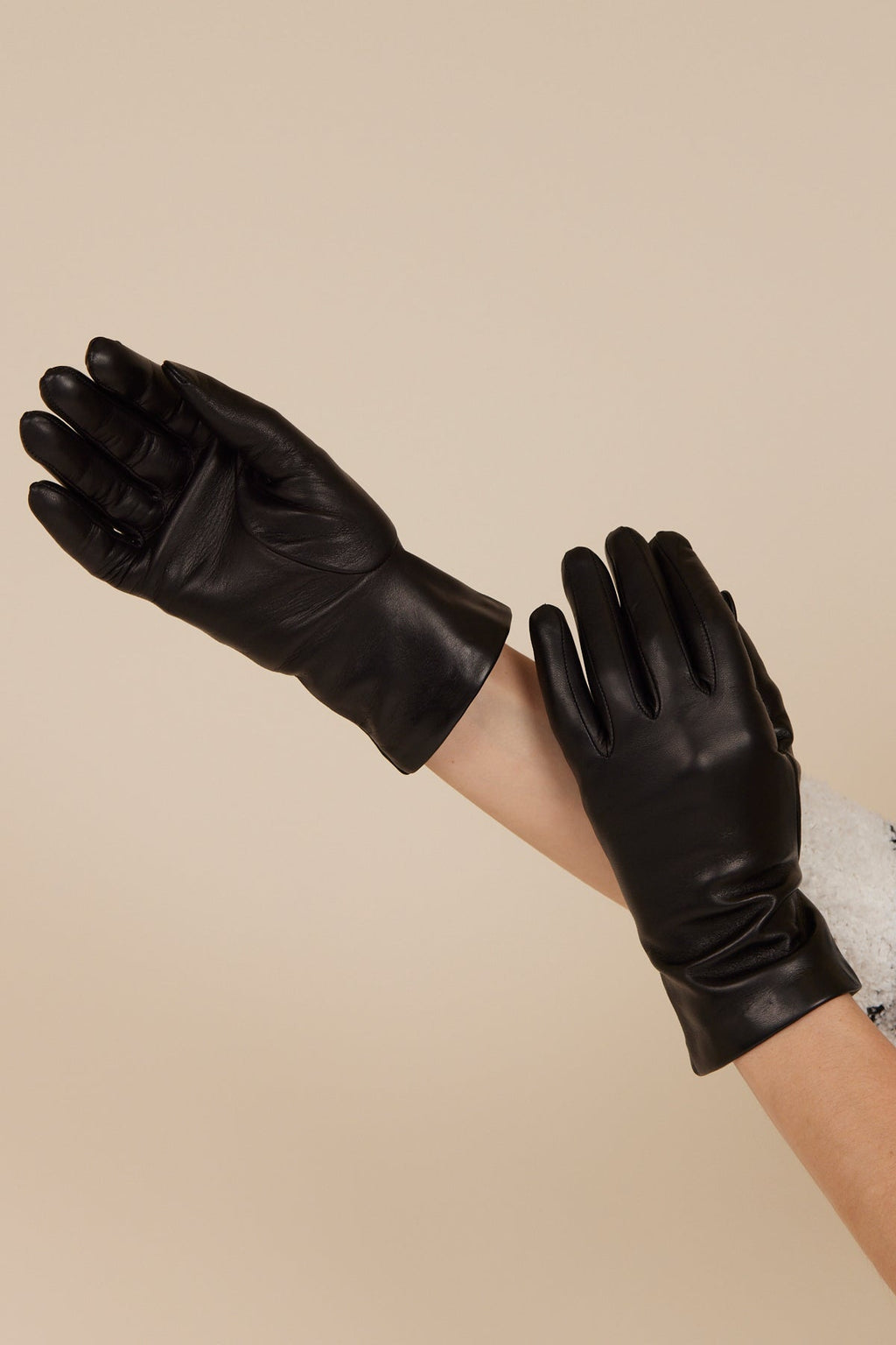 Pair of black women’s self-warming leather gloves