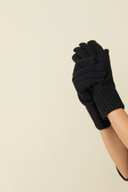 Black self-heating merino wool gloves, hands raised